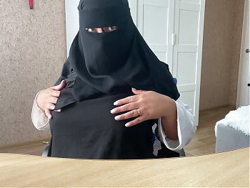 arabic muslim girl with big boobs in hijab sits on web chat live